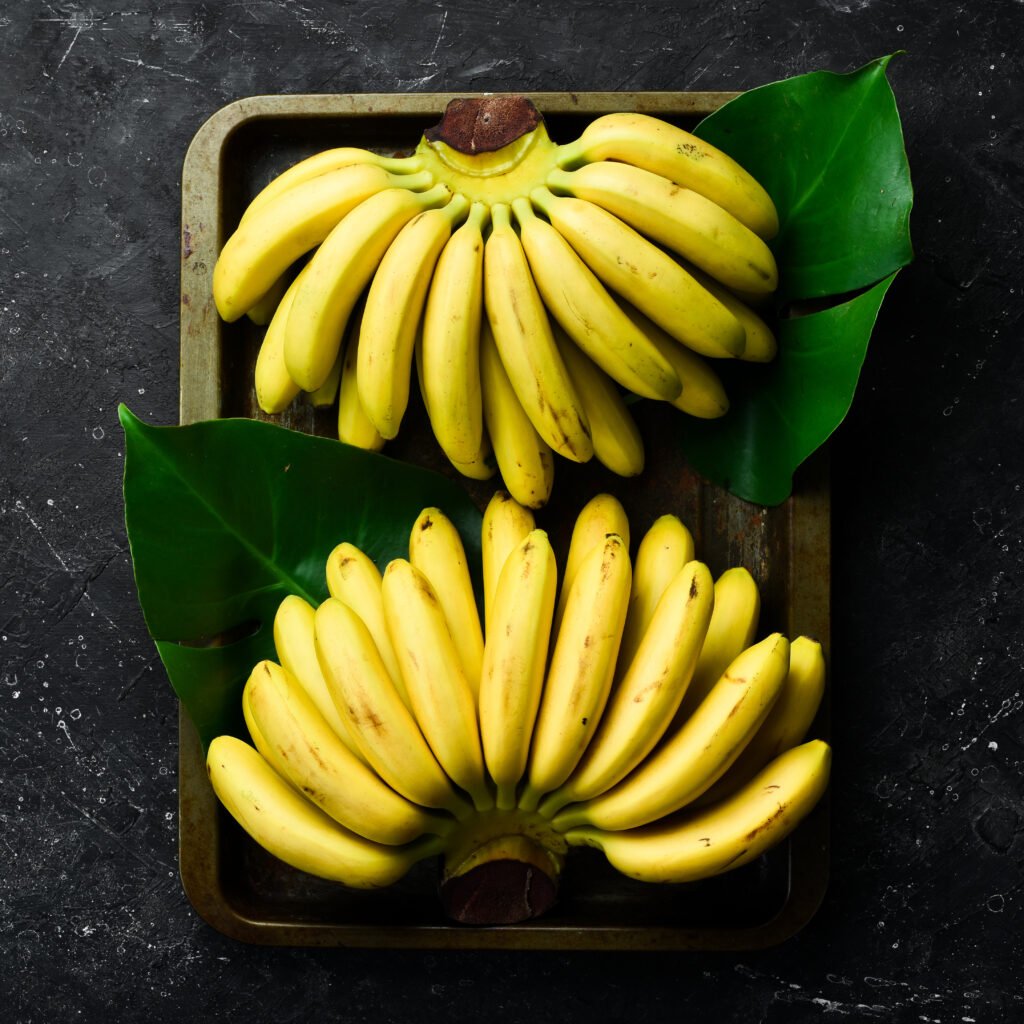 little tropical bananas set bananas black stone background free copy space